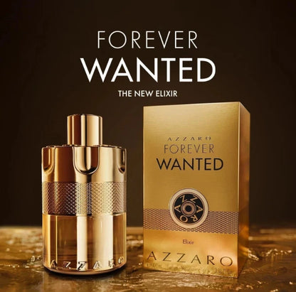 Azzaro Forever Wanted Eau de Parfum bottle and packaging box on a dark brown background with gold reflective surface below. Large text at the top reads 'FOREVER WANTED THE NEW ELIXIR'.